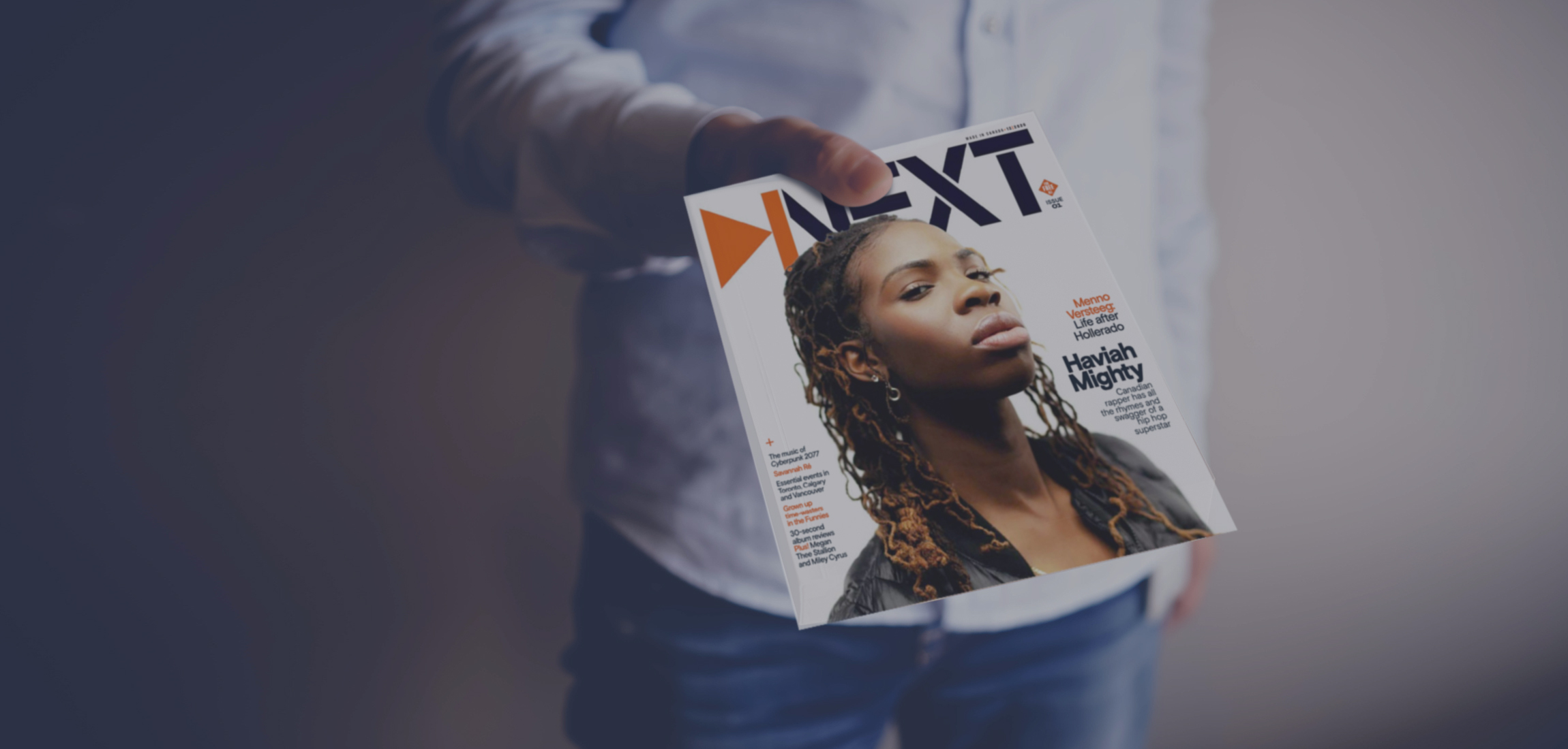 Person handing NEXT magazine to you