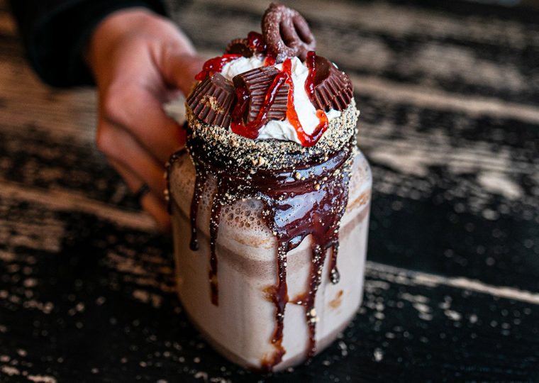 Person holding a hot chocolate