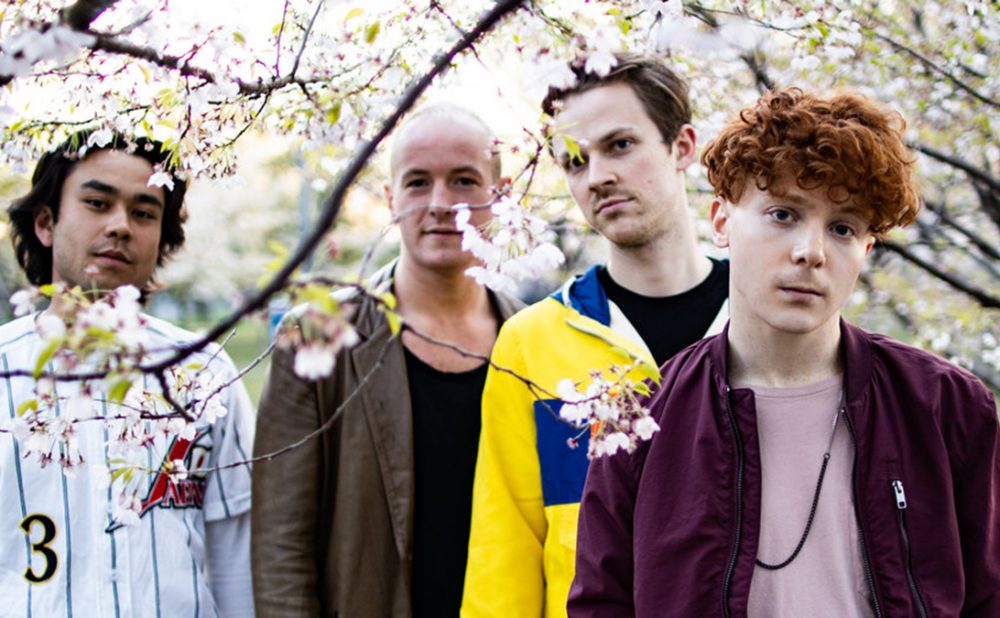 Birds of Bellwoods band members posing in park