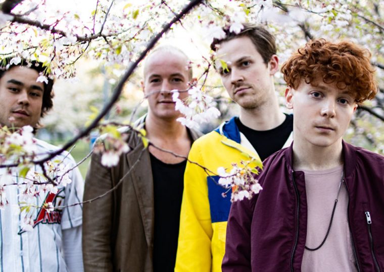 Birds of Bellwoods band members posing in park