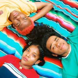BLACKSTARKIDS laying on blanket