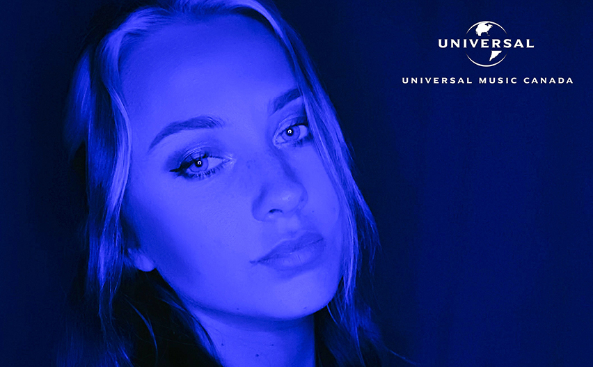 Kutcher posing with Universal Logo in top right