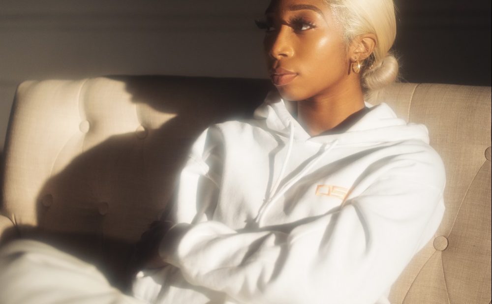 Osé sitting on couch