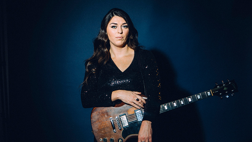 Terra Lightfoot posing with guitar