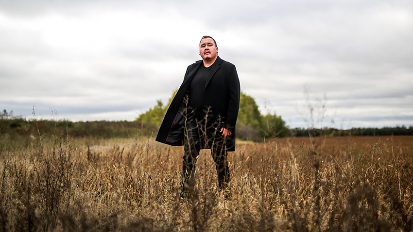 William Prince standing in field