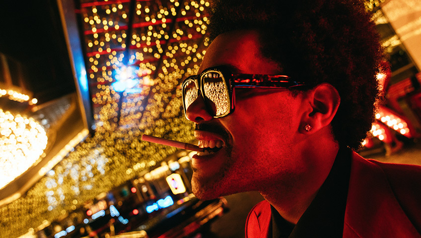 The Weeknd posing in casino