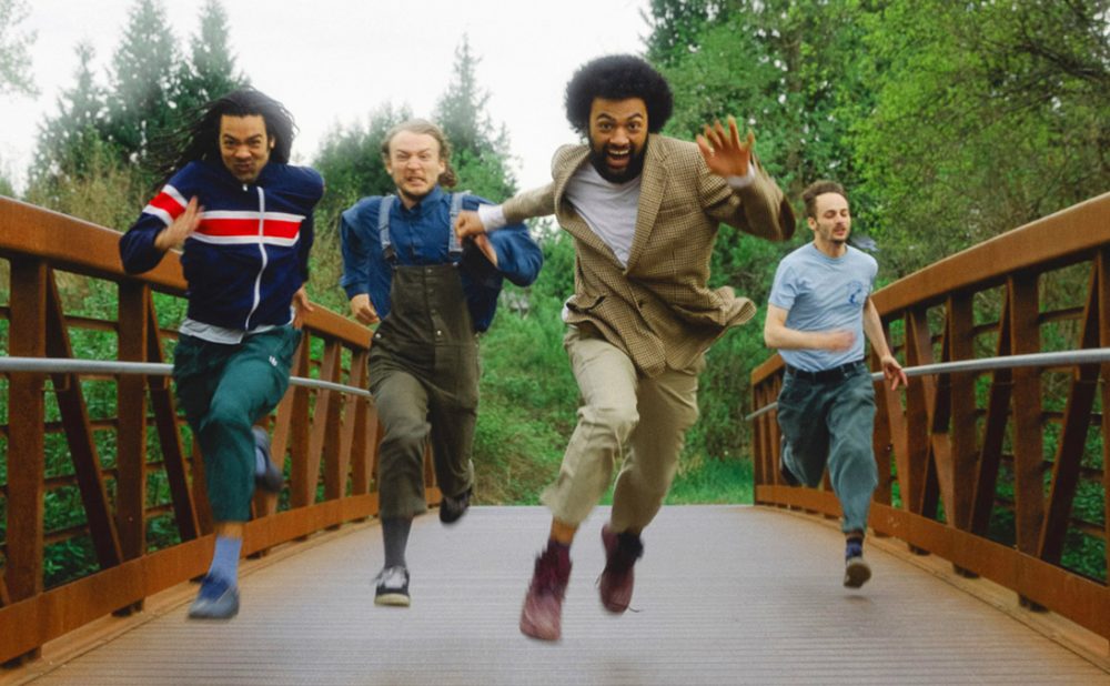 Schwey bandmates running on bridge