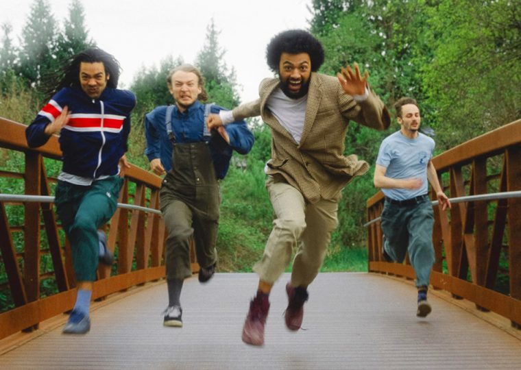 Schwey bandmates running on bridge