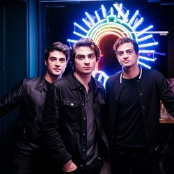 Ferraro posing in front of neon sign