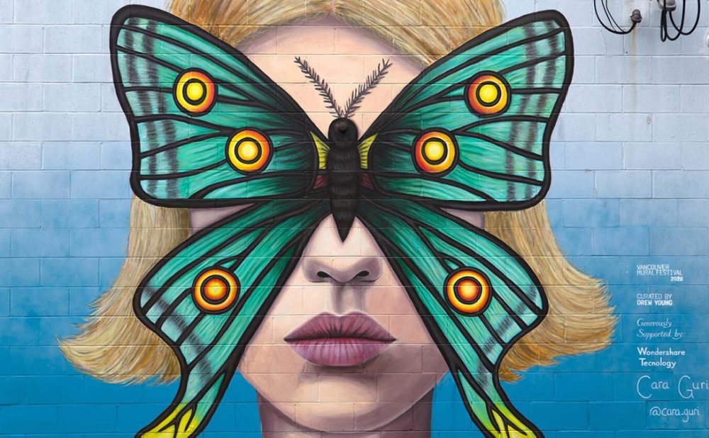 Art mural of woman with butterfly covering face