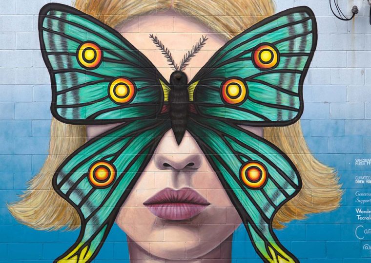 Art mural of woman with butterfly covering face