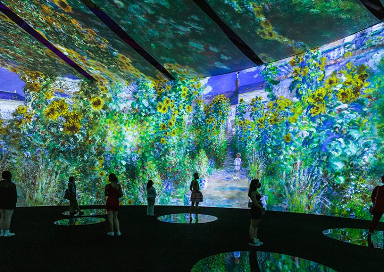 Attendees enjoying the immersive Monet exhibit.