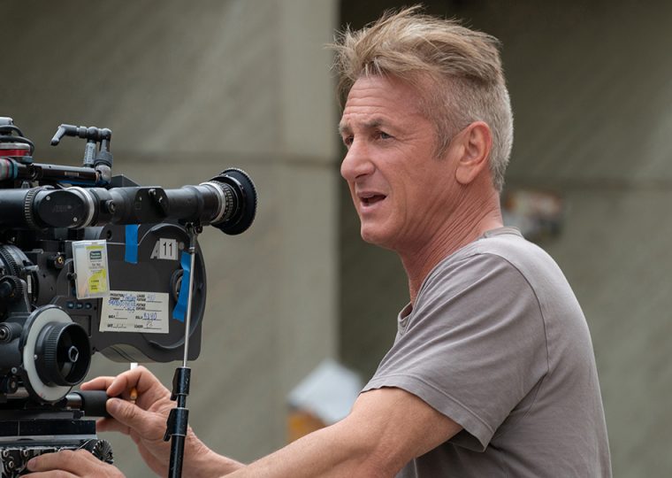 Sean Penn behind a film camera, directing on the set of Flag Day.