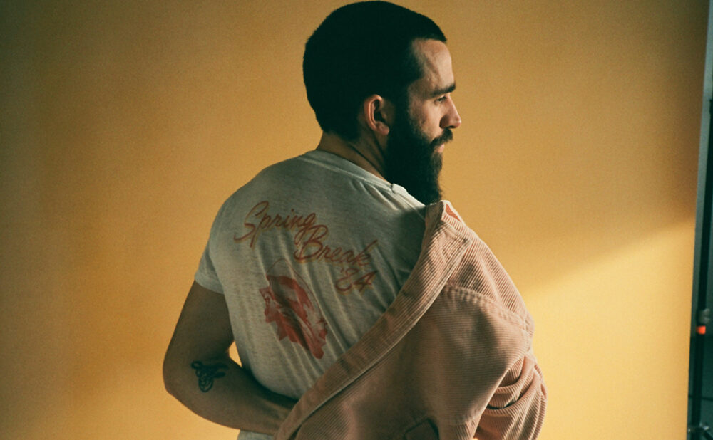 Michael Bernard Fitzgerald's back as he puts on a coat