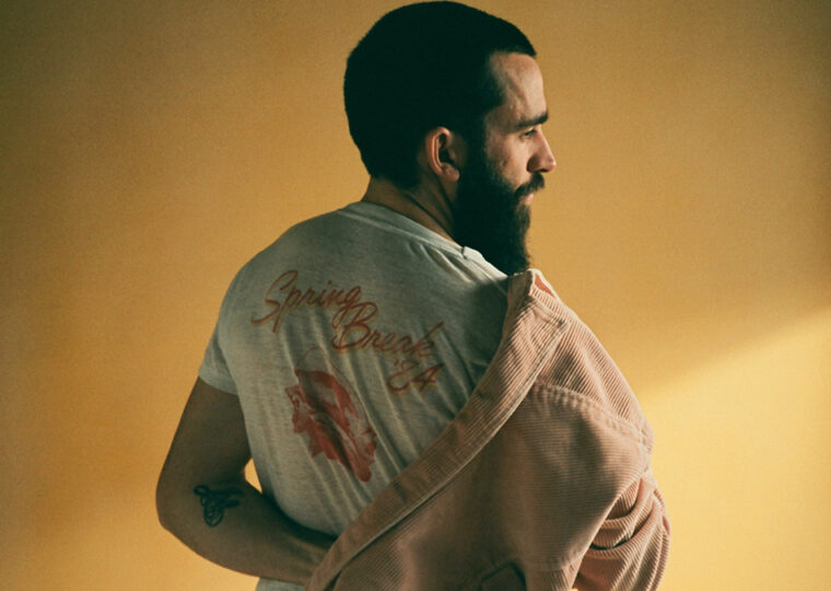 Michael Bernard Fitzgerald's back as he puts on a coat