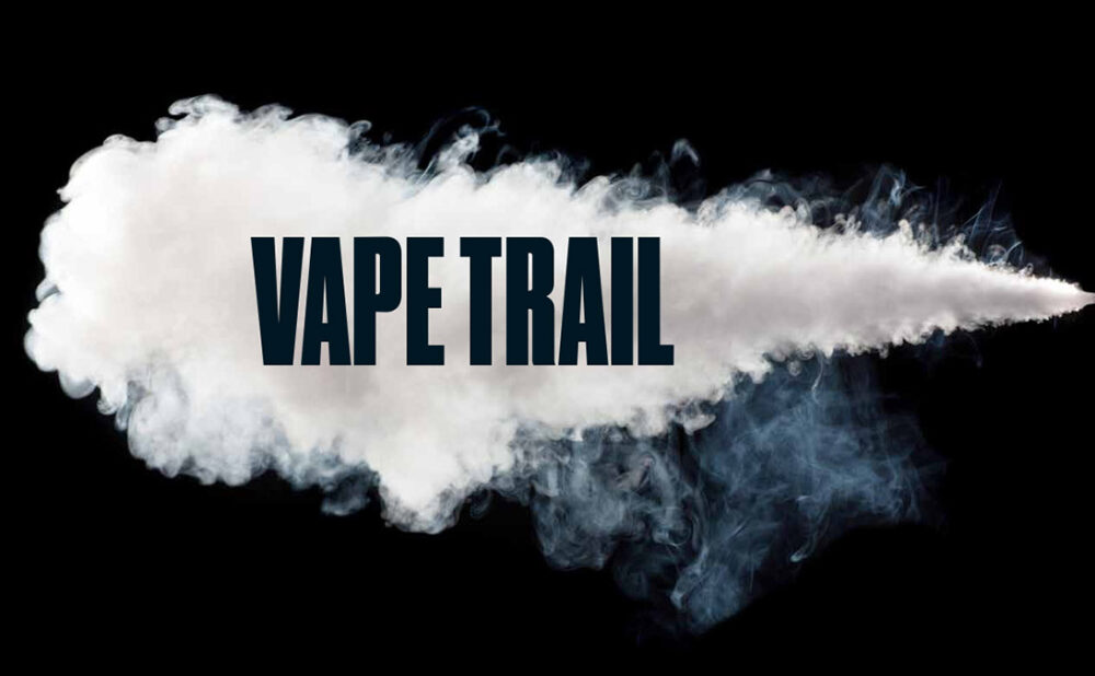 A cloud of smoke against a black background with the word VAPE TRAIL placed over the smoke