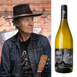 Jim Cuddy and a bottle of his Tawse Chardonnay wine.