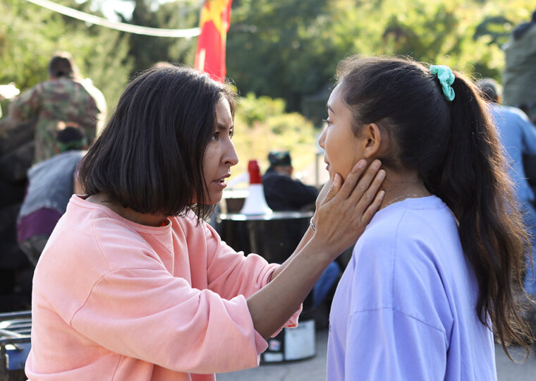 Still from the film Beans of a woman holding the face of a girl as they look at each other