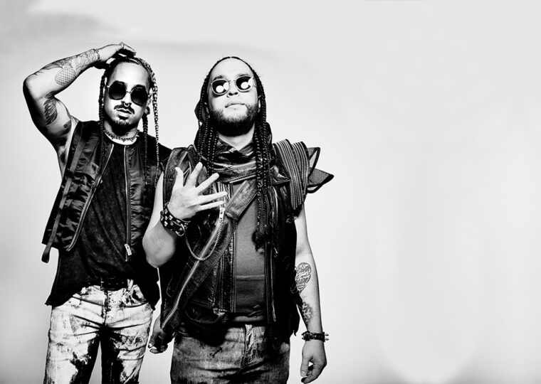 Music duo Snotty Nose Rez Kids posing against a white backdrop in black and white.