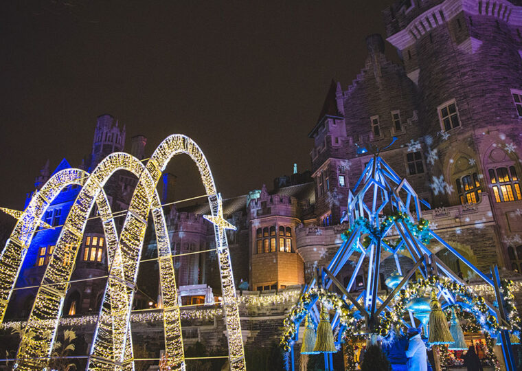 Casa Loma turned winter wonderland at night with colourful lights.